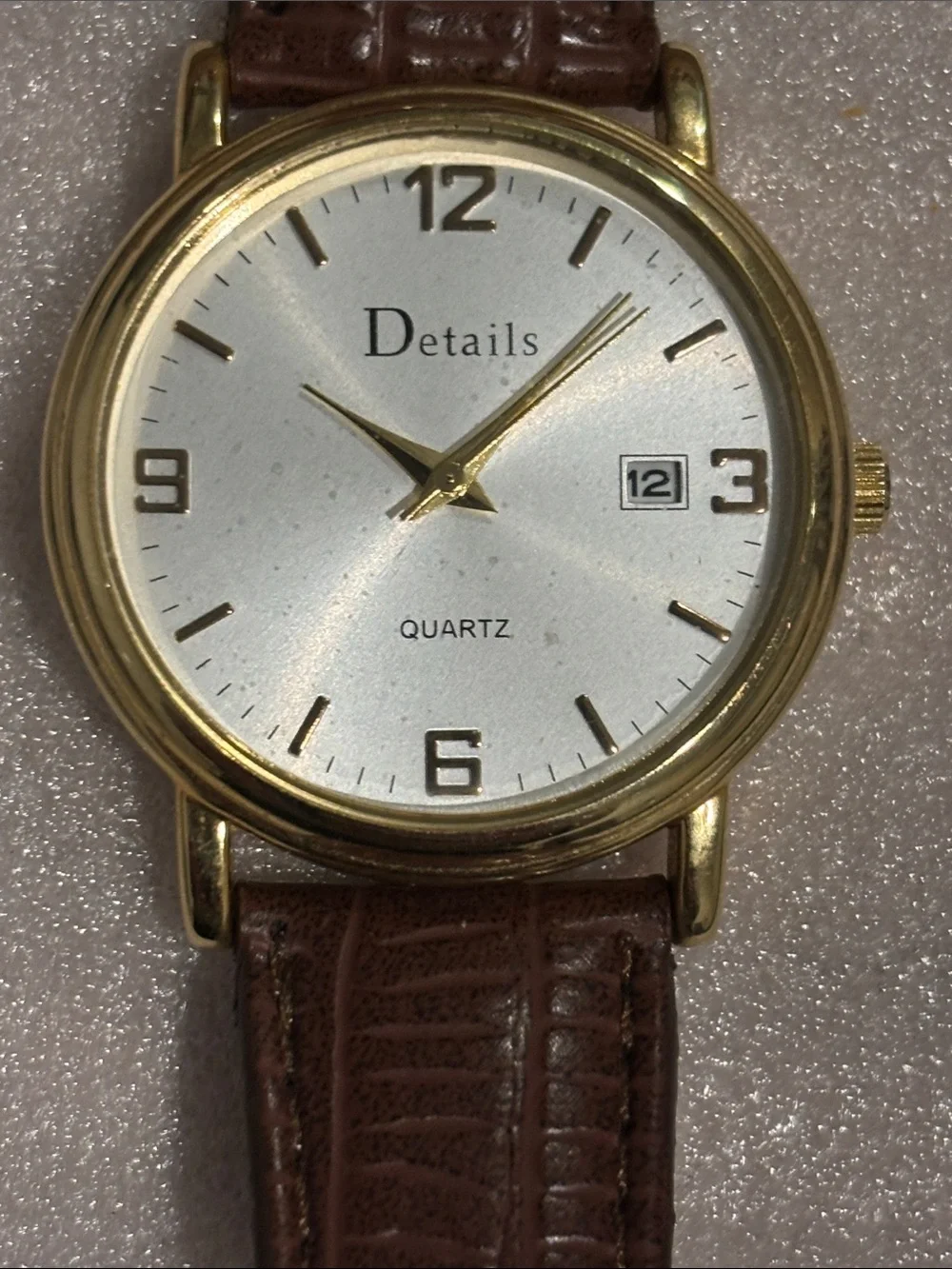 Gold-Tone Round Watch with Silver Dial and Brown Leather Strap